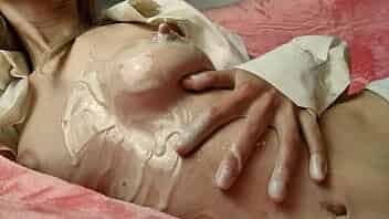 Sexy bitch playing with breast in condensed milk video